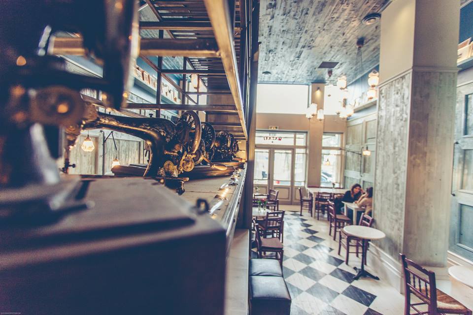 The warm wooden interior and tables at To Masali